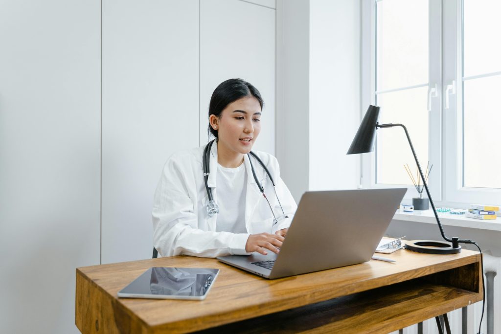 Doctor having appointment on computer